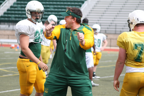 Adam Billings coaching during a North Bullitt football practice