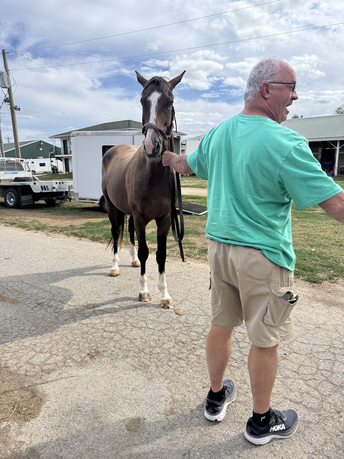 Bernie White Socks being led through the barn area